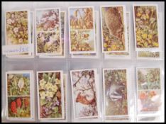 Cigarette Cards: An album of assorted vintage cigarette cards, all complete sets. From a large