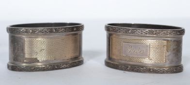 A pair of silver hallmarked napkin rings with cast Celtic borders, Birmingham assay mark for J B