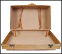 A vintage 1940s post-war cream leather suitcase of large proportions, with hinged top opening to