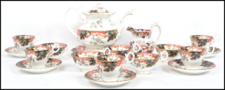 A good early 20th century tea service in an Imari pattern with bubble decorations. The set