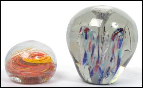 Two large heavy Victorian 19th century end of day glass paperweight dumps, one possibly Nailsea