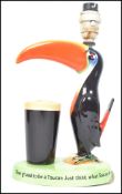 An original Guinness advertising Carlton ware Guinness lamp base, modelled as a Toucan with