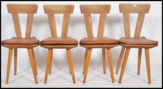 A set of four stunning mid 20th century beech dining chairs, chunky V shaled back slats with