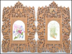 A pair of 19th century Indian carved wooden picture frames having a pierced decoration depicting