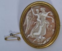 A 19th century shell cameo brooch depicting scenes of cherubs and goddess set in a yellow metal