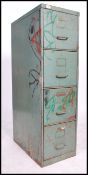 A vintage retro 20th century four drawer industrial filing cabinet retaining original distressed
