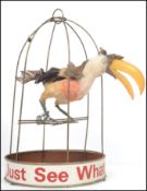 An original vintage 20th century Guinness advertising piece in the form of a Toucan with real