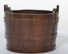 A 19th century treen salt condiment in the form of a bucket with original cut glass liner.
