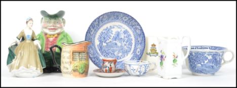 A collection of ceramics dating from the 19th century to include a Toby Jug, Japanese cup and