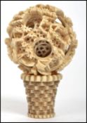 A 19th century Chinese hand carved seven layer ivory puzzle ball decorated with domestic scenes with