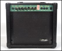 A contemporary music AMP - amplifier by Stagg model No 20GA in carry case with handle atop over