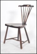 A 19th century possible spindle back Goldsmith type windsor nursing chair having an elm saddle