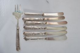 A set of six harlequin silver handled hallmarked butter knives together with a silver handled
