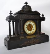 A Victorian Large slate 8 day mantel clock with Romanesque style with triple columns either side and