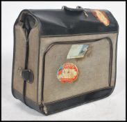 A vintage mid 20th century folding valet / suitcase. Finished in a two tone colourway, zip opening