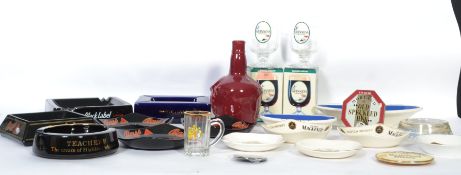 A collection of breweriana items to include advertising ashtrays such as Martell ( Bristol