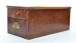 A vintage 20th century wooden cash register till having a pull out sectional drawer with bell and