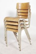 A set of four vintage mid 20th century metal tubular stacking chairs, vinyl seat pads and back