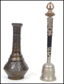 A Chinese bronze vase of baluster stepped form with leaf and bird decoration along with a silver