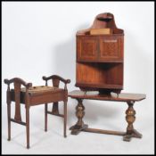 A Victorian mahogany corner cabinet with central cupboard and shelves to the sides together with a
