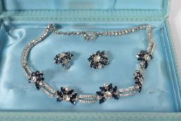 A 1950's blue and white rhinestone set necklace and earring set in presentation box. The necklace