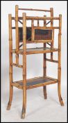 A 19th century Victorian aesthetic movement bamboo Canterbury magazine stand having a lacquered