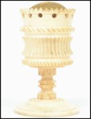 A 19th century Ivory pin cushion in the form of a chalice goblet raised on a circular foot with
