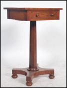 A 19th century Regency mahogany pedestal side table. Raised on trefoil base with shaped column