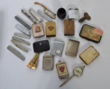 A good collection of vintage 20th century lighters, penknives and vesta cases.