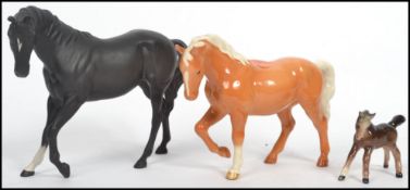 A group of three Beswick ceramic pony / horse figures to include a Matt Black Beswick horse, a
