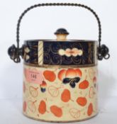 A 19th century English Factory ceramic biscuit barrel having a painted Imari pattern with cobalt and