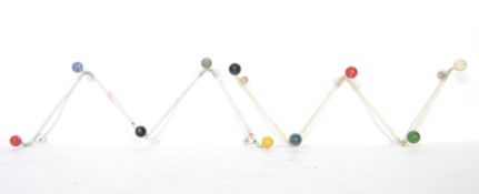 A pair of vintage 20th century retro sputnik atomic set of coat hooks in a painted white finish with