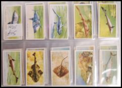 Cigarette Cards: An album of assorted vintage cigarette cards, largely complete sets, some near-
