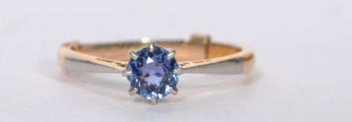 An 18ct gold and sapphire ring set with a single round cut blue sapphire. Mark worn, tests 18ct