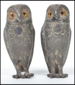 A pair of 19th century Victorian novelty condiments in the form of owls having glass eyes with twist