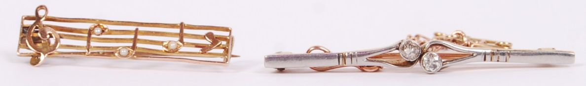 Two Edwardian ladies bar brooches comprising a platinum and 9ct gold old cut diamond brooch and a