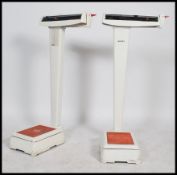 A pair of large 20th century Industrial / medical doctors weighing scales complete with original
