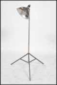 A vintage / retro floor standing lamp, converted from a Smith Victor camera light having a