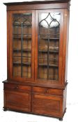 An exceptional large 19th century rosewood library bookcase cabinet on stand. The stand with a