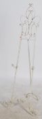 A vintage 20th century cast metal easel stand having pierced and scrolled decoration painted in a