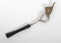 A silver filigree opium pipe having a bowl in the form of a flower with ebonised mouthpiece.