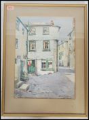 A vintage 20th century water colour painting of a street scene signed by artist Frank Belcher,