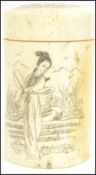 A 19th century Oriental ivory cricket catcher pot box of cylindrical form having Geisha decoration