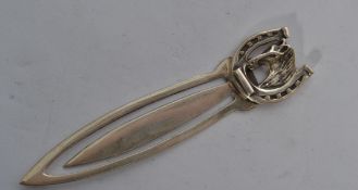 A sterling silver paperclip / bookmark having an horse in horse shoe finial handle marker, stamped