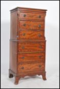 A Regency revival mahogany straight front six drawer tall boy chest of drawers, drop handles