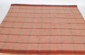 A decorative 20th century woollen welsh blanket with vivid colours and geometric patterns having
