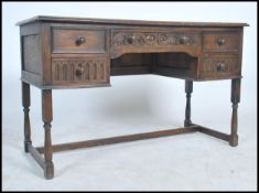 An Old Charm type Jacobean revival oak and leather