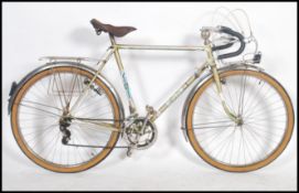 A vintage 1960's gents French eight speed touring bike, leather saddle, gear levers to frame,
