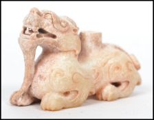 A beileved 19th / 20th century well carved white mutton Jade Chinese temple lion - fu dog being