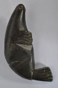 An early 20th century Inuit soapstone carving of a seal.